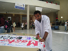 MSU president, Vishal Tiwari, signs the banner in support of 