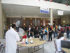 Vishal Tiwari serves up candy floss for a line of students.