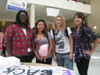 Farida Adam (Left) Gail Poskitt, Dori Hone and Tracy Hoang sign the banner for "Take Back the Night"